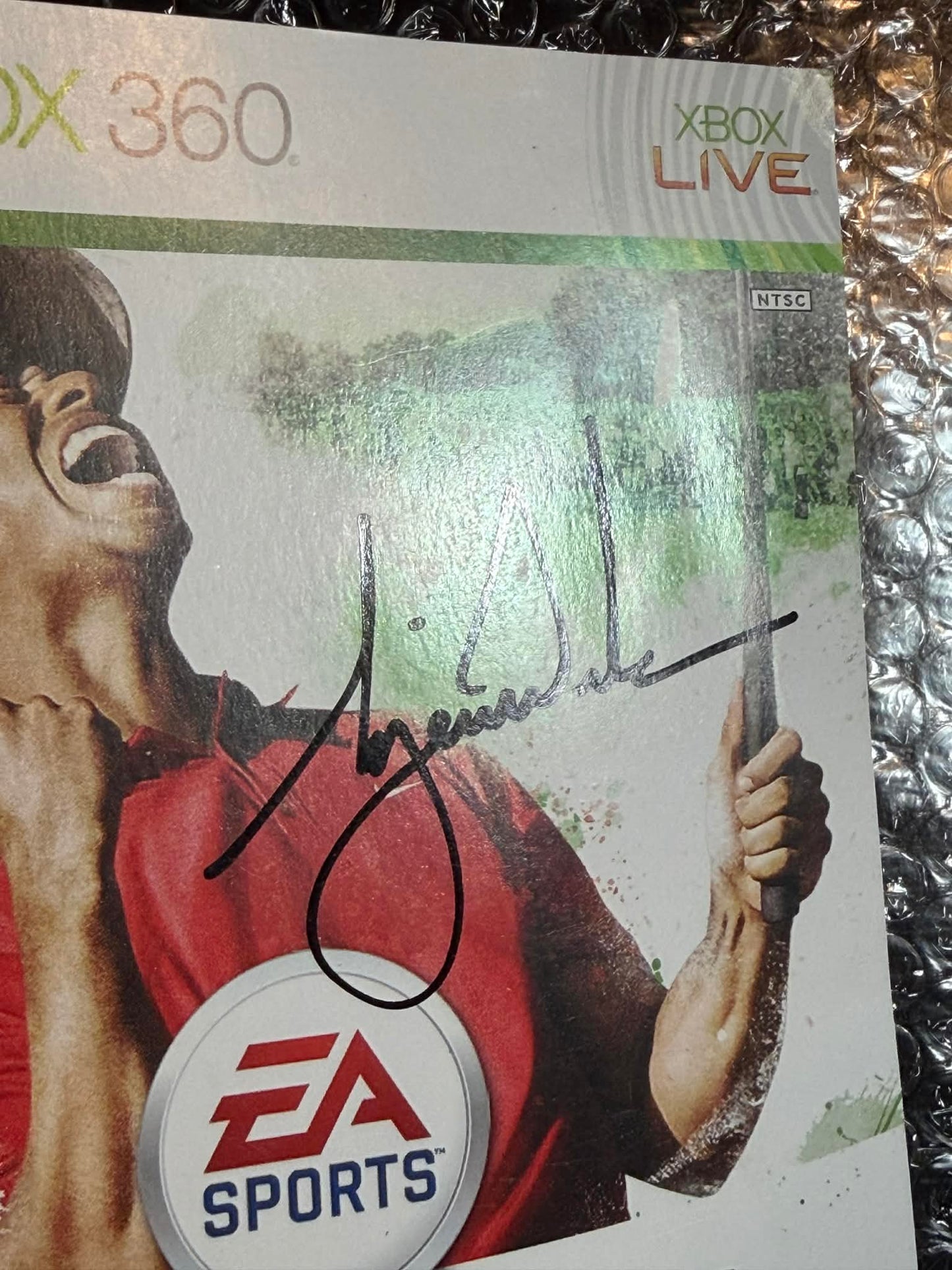 TIger woods signed x box cover UDA( FILL IN )